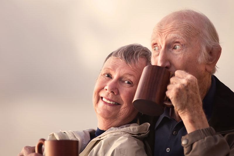 Dental Implant Patients Smiling Together And Drinking Coffee