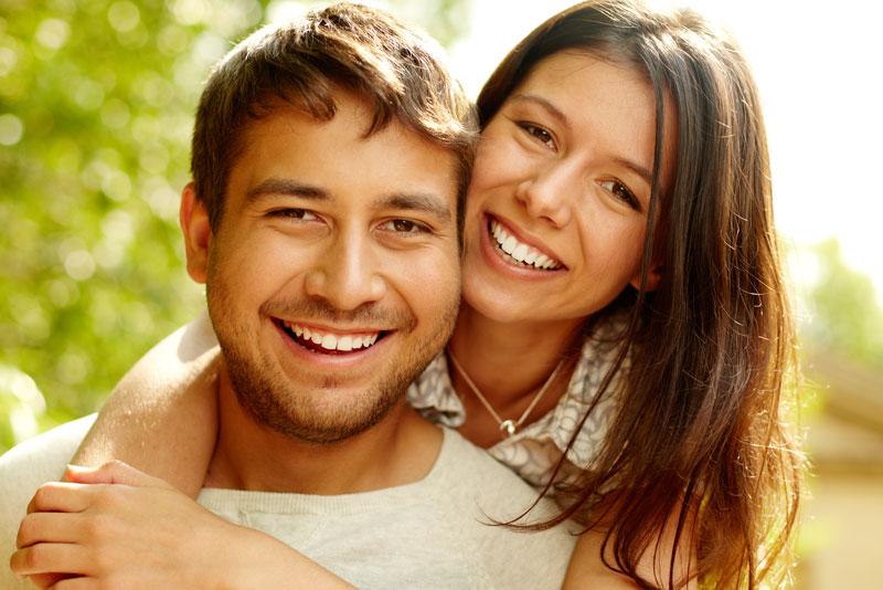 Dental Patients Smiling With Well Cared For Dental Implants In Scituate, MA