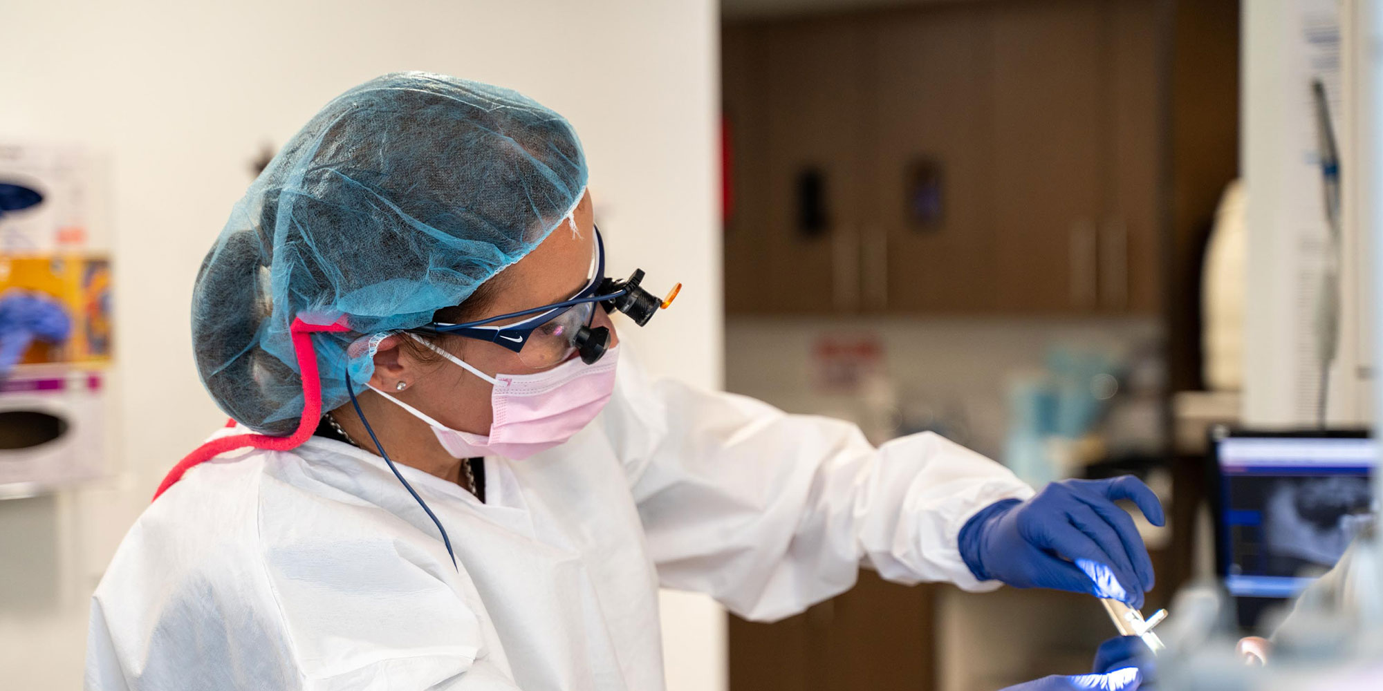 Dr. Theresa Salem placing implants